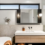 bathroom with marble tile slabs and above ground bathtub